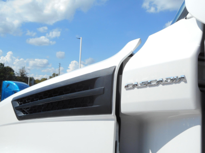 Freightliner Cascadia 126 front cab close-up showing Cascadia badge and grille