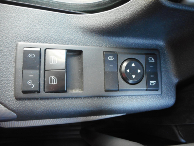Freightliner Cascadia interior control panel showing seat adjust and mirror/window switches