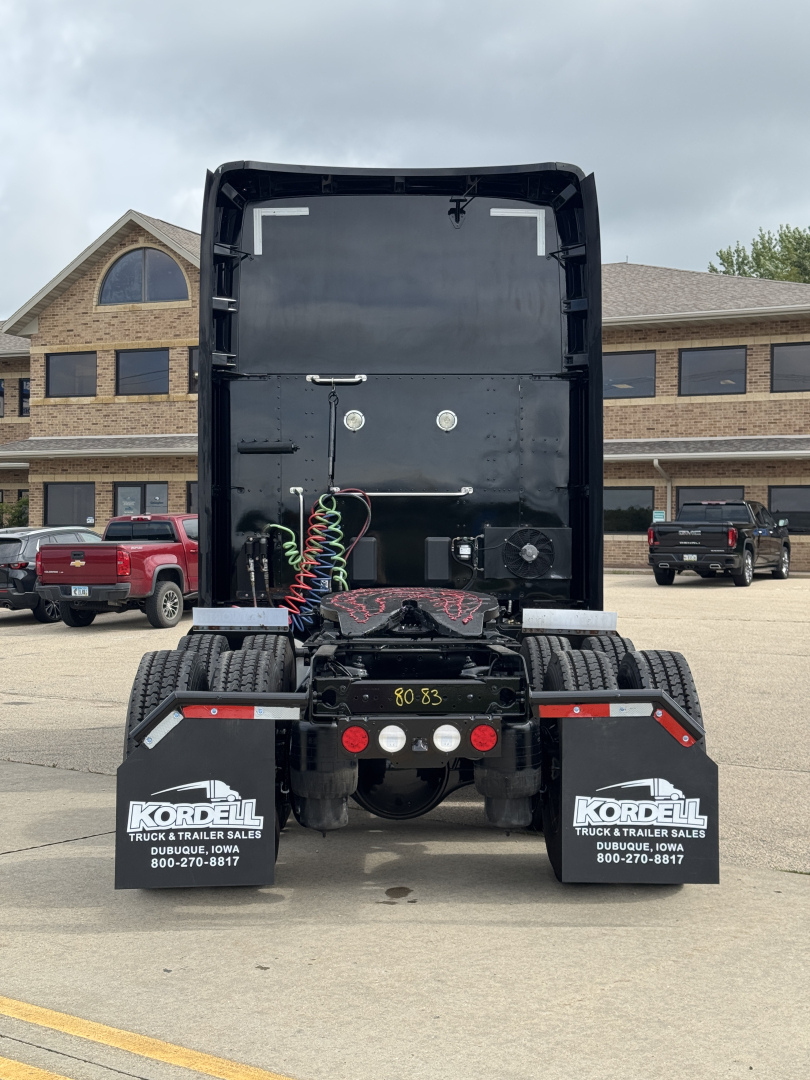 Kenworth T680 rear view showing chassis and fifth wheel with air lines and bumper mud flaps with Kordel logos.