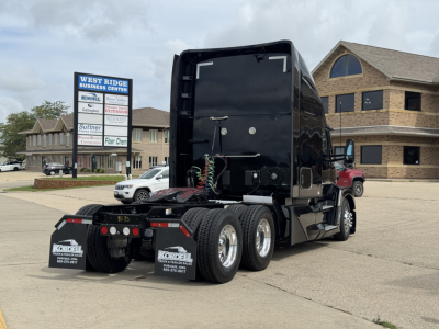 Kenworth T680 tractor, black, side and rear view with dual rear axles, mud flaps reading Kordell with phone numbers, rear black fifth wheel area, trailer connections visible.