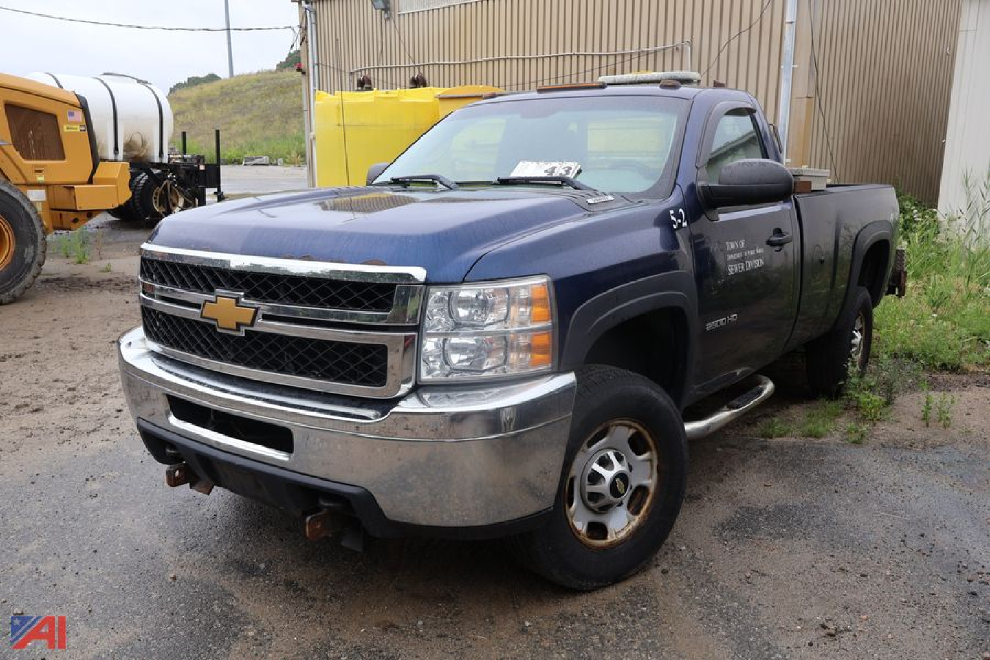 Chevrolet Silverado 2500HD pickup truck in blue, front-left view with chrome bumper and Chevrolet emblem, used condition.