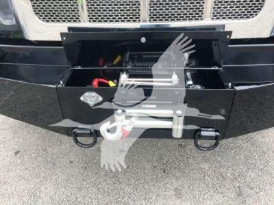 Peterbilt 337 front with mounted front hitch and storage box; visible components include winch/boom mount and electrical wiring inside the open toolbox
