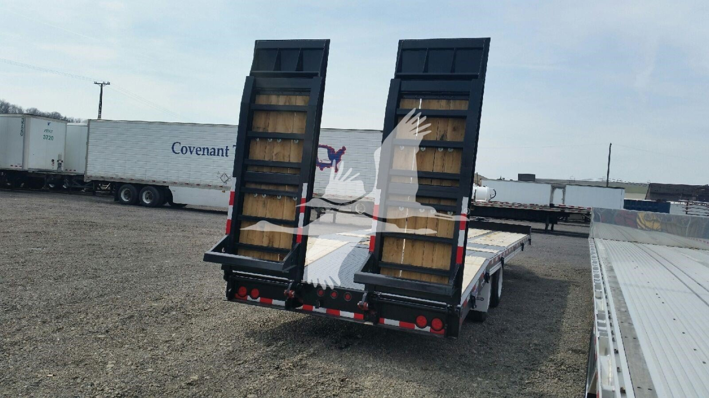 Trailer rear view showing two swing-out loading ramps and flatbed deck, with reflectors and rear lights.