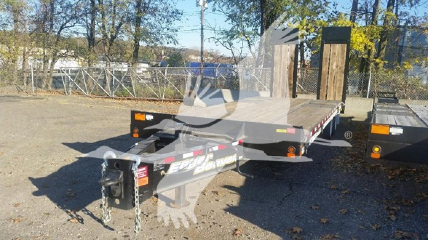 Trailer hitch and flatbed trailer showing Eager Beaver branding, front neck with coupler and safety chains, flatbed with wooden deck in a parking lot.