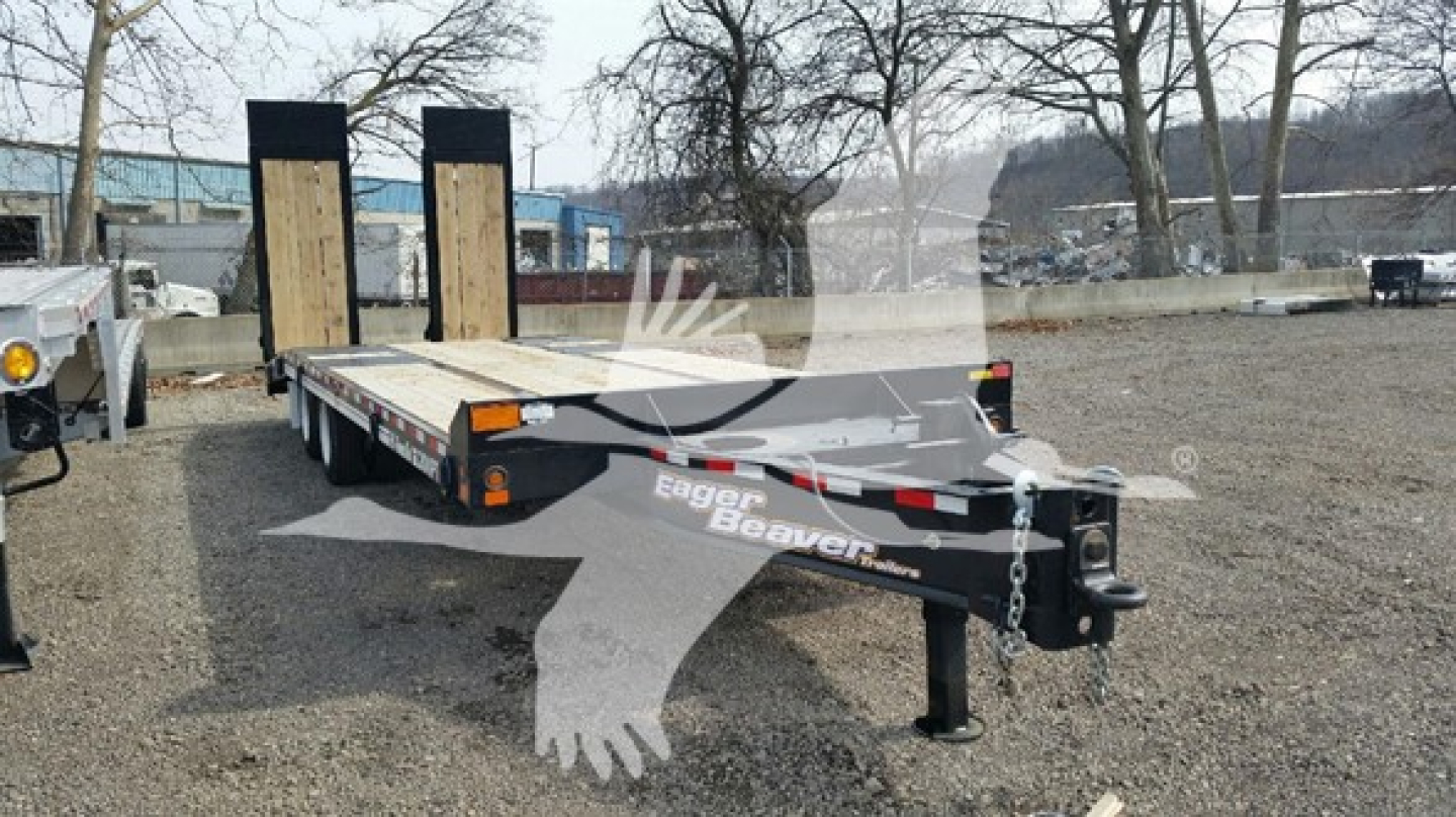 Flatbed trailer showing dual ramps and hitch with warning chains; Eagle Beaver branding on frame; model 2026 Eager Beaver Xpt.