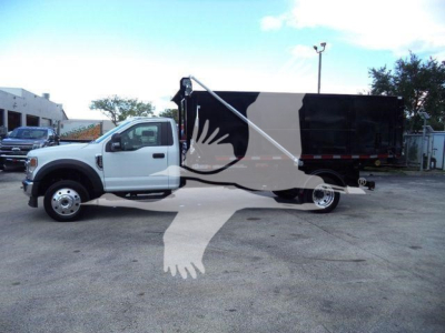 Ford F-550 roll-off truck side view showing cargo box and graphics