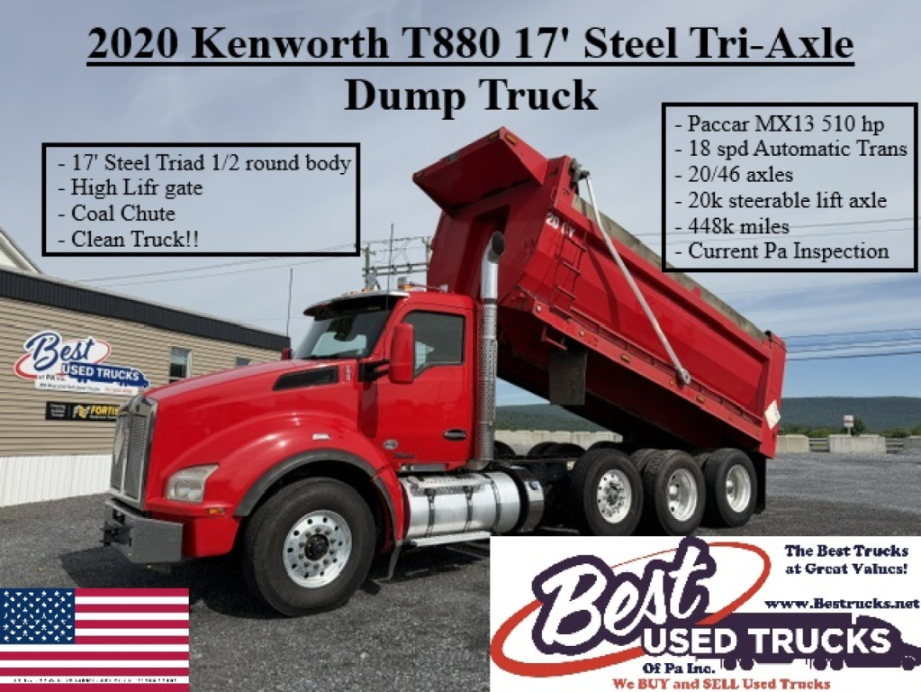 Kenworth T880 dump truck in a red paint scheme, 17' steel tri-axle, dump bed raised, side banners list features and mileage notes.