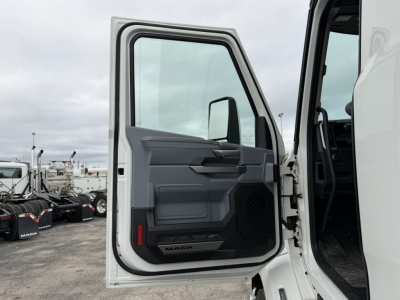 Mack AN64T convention daycab truck door open showing interior entry and exterior panels.