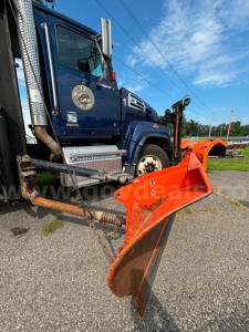 Truck cab of 2018 Western Star 4700 with front plow and side exhaust visible