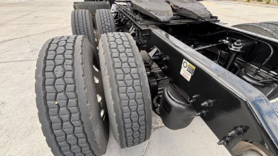 Kenworth T680 chassis showing dual rear axle wheels, black frame, and drivetrain area; no cab or engine details visible.