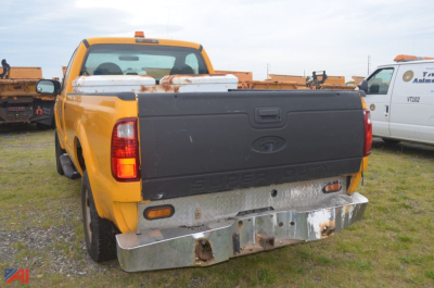 Ford F-250 Super Duty dump truck rear view showing chrome bumper and tailgate.