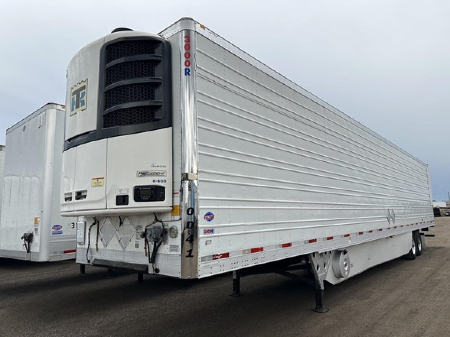 2020 Utility 3000R reefer trailer with front refrigeration unit and chrome side rails, viewed from left-front angle; visible VIN sticker and model branding.