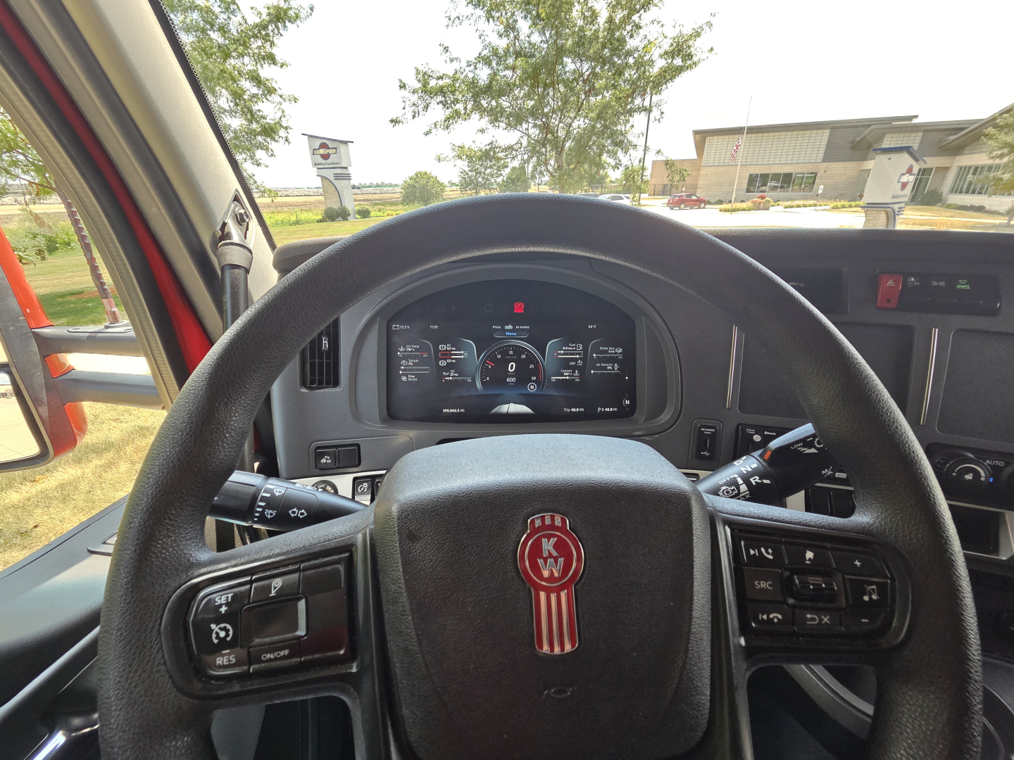 Kenworth T680 dashboard and steering wheel interior view with instrument cluster and controls visible