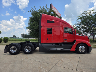 Kenworth T680 tractor in red, side profile view showing sleeper cab and chassis with dual rear axles.
