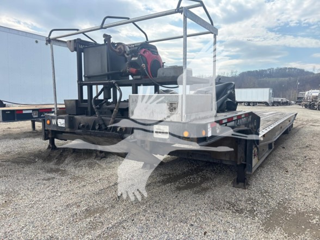 2014 Landoll 440B traveling axle trailer with hydraulic equipment and platform, rear end view showing deck and equipment cradle, VIN plate not visible.