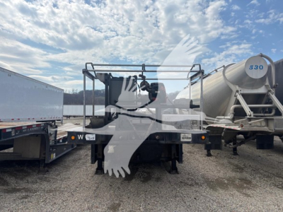 2014 Landoll 440B trailer rear view showing underside framework and hydraulic components; large dual-axle setup with trailer kingpin area visible.