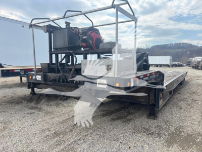 2014 Landoll 440B traveling axle trailer with hydraulic equipment and platform, rear end view showing deck and equipment cradle, VIN plate not visible.
