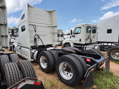 Truck tractor cab and chassis view showing rear wheels and fifth wheel on a 2019 Volvo VNL 760 VIN 4V4NC9TH7KN205523