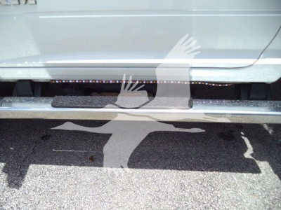 Ram 5500 rollback truck side view showing step bar and lower body with stock number tag