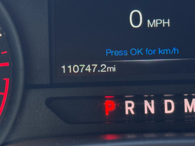 Ford F-150 dash display showing 0 mph, odometer 110747.2 miles, gear selector P, and a portion of the speedometer.
