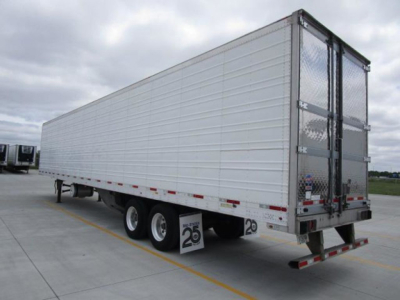 Trailer side view of a 2022 utility refrigerated trailer showing tandem axles and rear doors.