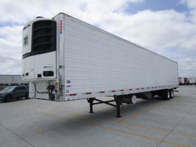 Trailer trailer refrigeration unit at front with white body, side panels, and refrigeration unit mounted at front. Visible text on unit includes 'THERMO KING' style label and numbers '3000R' on vertical edge; trailer has no other legible la