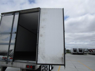 Utility reefer trailer showing rear doors open and cargo area visible.