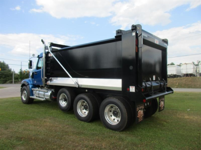 Western Star 49X dump truck in profile view showing black dump bed, blue cab, tandem rear axles, hydraulic hoist, and side steps. No visible text captured on components.