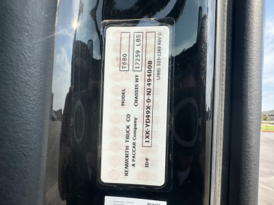 Label on Kenworth T680 door jamb showing model T680, GVWR 60,000 lbs, KC packing? serial numbers and barcodes.