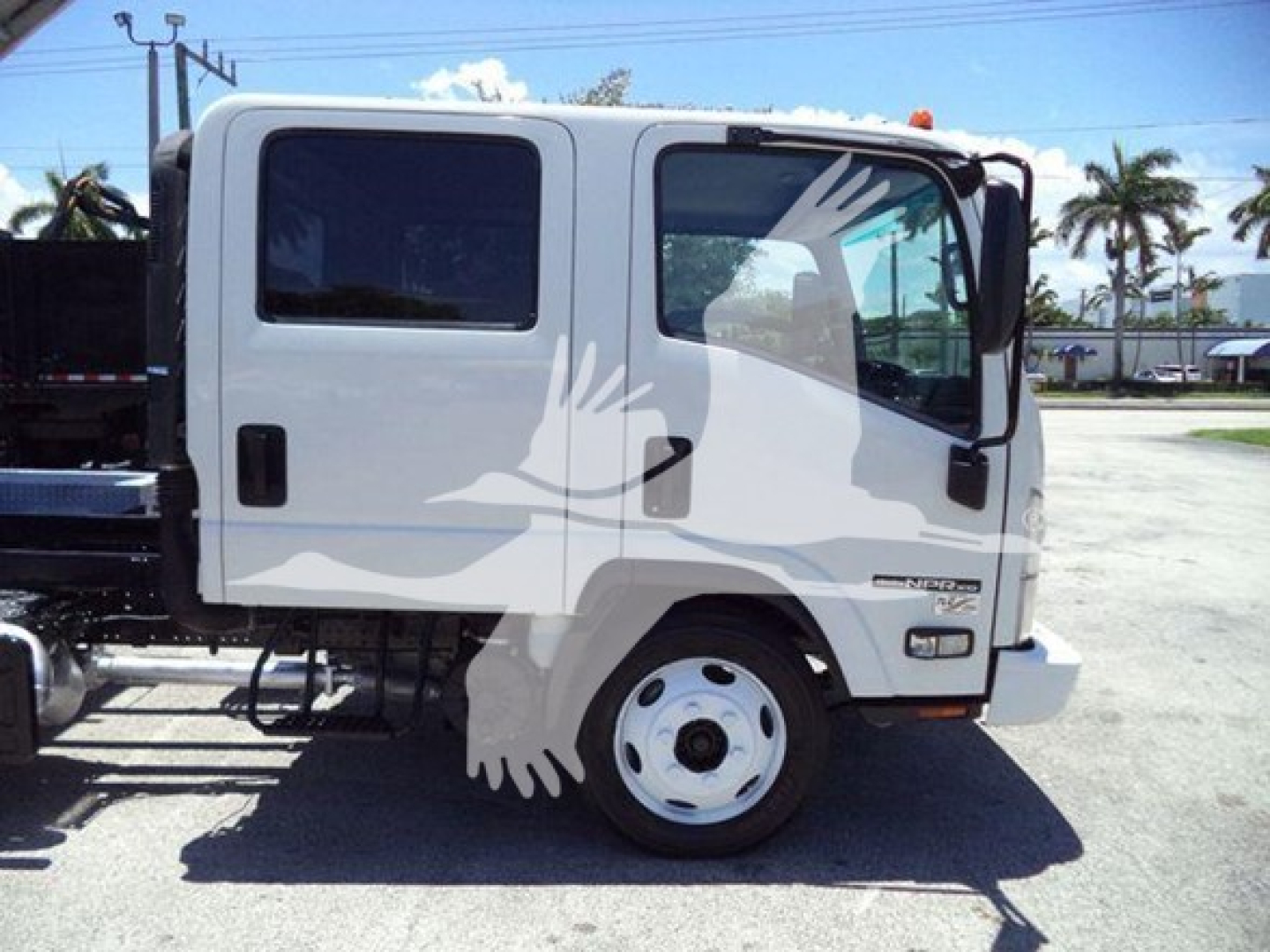 Isuzu NPR-HD truck cab side view showing two doors and wheel, white color with a silhouette watermark across the image.