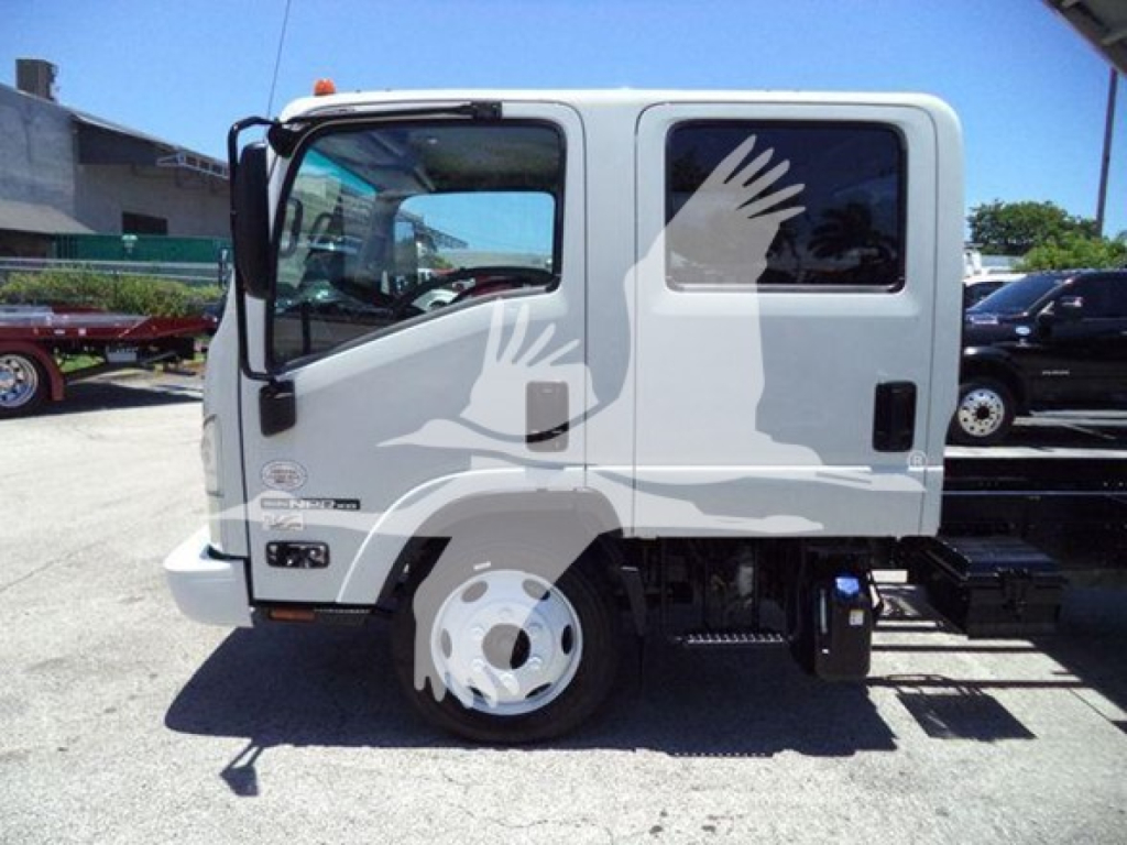 Isuzu NPR HD cab showing side view with white exterior, single cab, wheel, and body decal; truck in lot.
