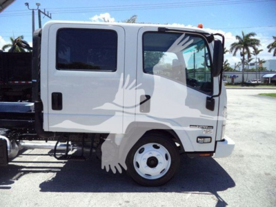 Isuzu NPR-HD truck cab side view showing two doors and wheel, white color with a silhouette watermark across the image.