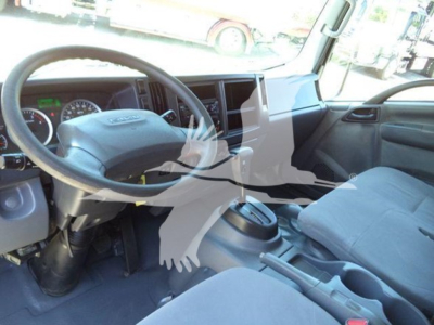 Isuzu NPR HD truck interior showing steering wheel and dashboard, front seats, center console view