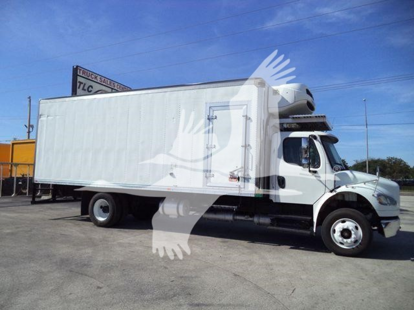 Side view of a white 2016 Freightliner M2 106 refrigerated truck with a box body and cab, stock number 24016RFM visible.