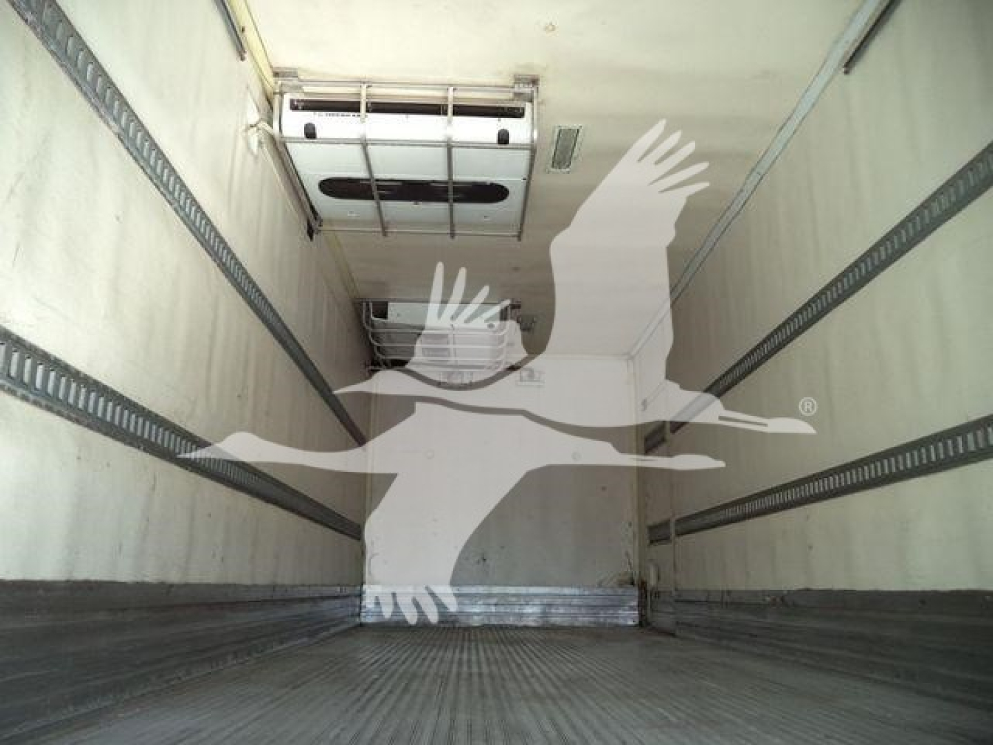 Interior of Freightliner M2 106 trailer showing metal cargo walls and ceiling, with a roof vent hatch and insulation panels.