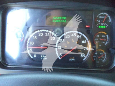 Vehicle dash gauge cluster showing speedometer, tachometer, and odometer reading 372,555.3 miles; assorted gauges and warning lights.