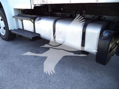Freightliner M2 106 side view showing cylindrical fuel tank and underbody steps.