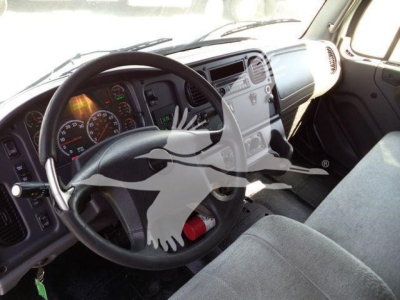 Freightliner M2 106 interior view showing steering wheel and dashboard