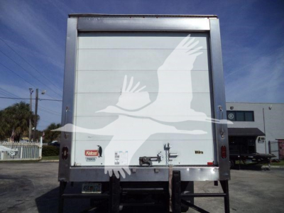 Freightliner M2 106 rear view with cargo door and liftgate in aluminum frame.