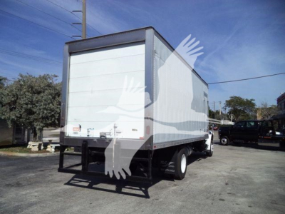 Freightliner M2 106 refrigerated truck in-service rear view showing cargo box and rear bumper with lift gate.