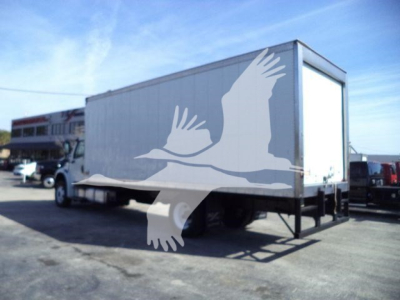 Refrigerated box truck seen from side, Freightliner M2 106 with white cargo box mounted on chassis; watermark of a bird overlay in the foreground.