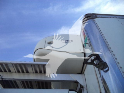 Truck refrigeration unit on Freightliner M2 106 cab with trailer, side view showing bunk, hatch and mounting bracket.