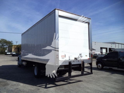 Freightliner M2 106 box truck rear view showing refrigerated truck body and back doors with bumper and undercarriage visible.
