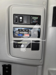 Panel inside a 2018 International LT cab showing controls and switches with labeled buttons and digital display.