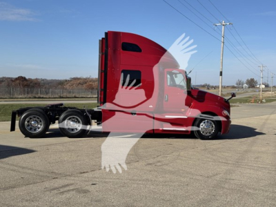 2018 International LT conventional sleeper truck in red, side profile, with twin rear axles and high sleeper cab, parked on pavement.