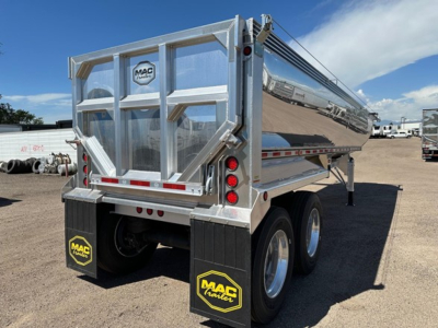 Macsimiser half round aluminum end dump trailer showing rear view with MAC trailer logo, tail lights, and dual axles.