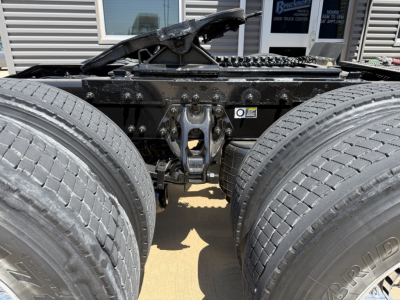 Peterbilt 579 truck chassis showing rear dual axle assembly and sixth-wheel area with tires and frame visible.