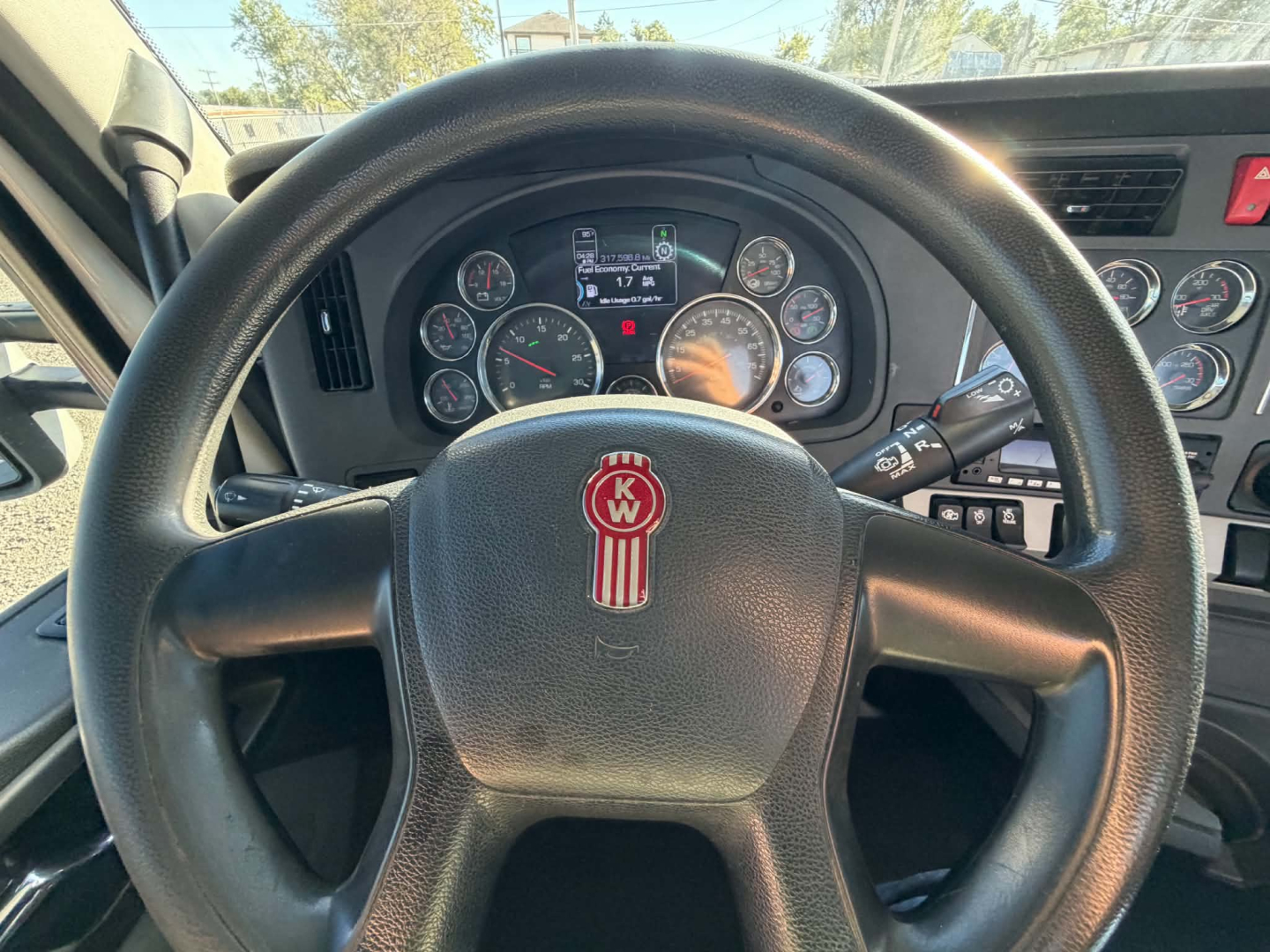 Kenworth T880 truck interior steering wheel and dashboard with gauge cluster and controls.
