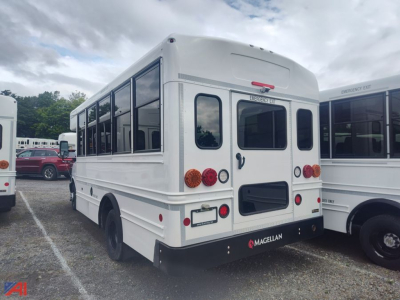 Bus rear view of a white 2026 Chevrolet Express G4500 MFSAB bus showing rear doors, taillights, and Magellan bumper.