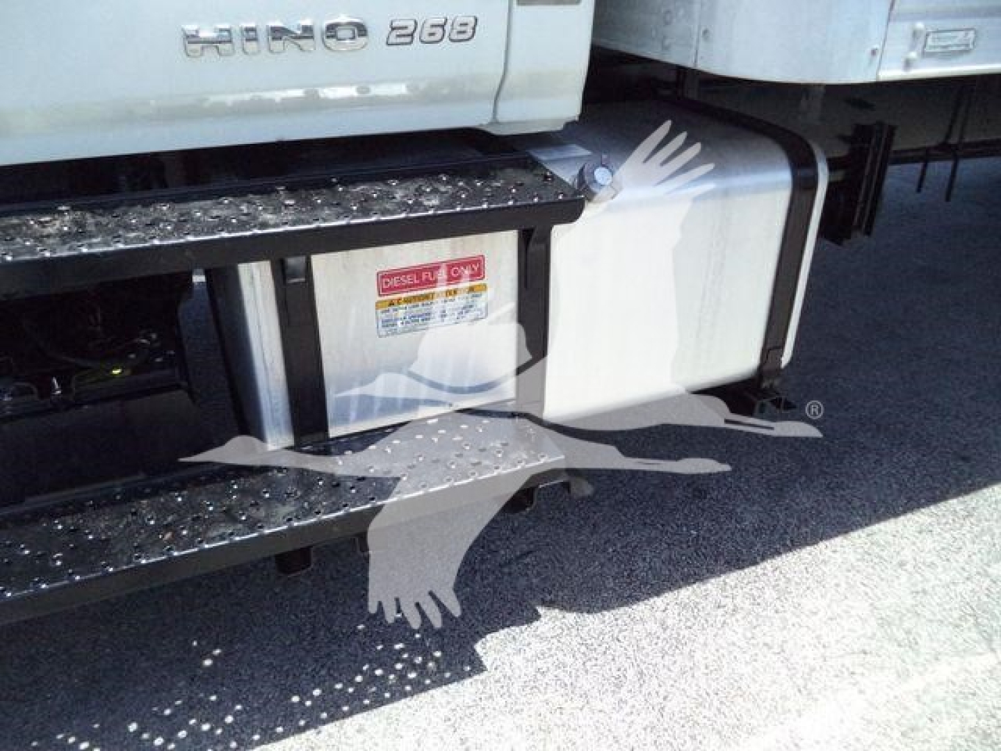 Truck side view showing fuel tank and steps with 'HINO 268' badge and diesel only label.
